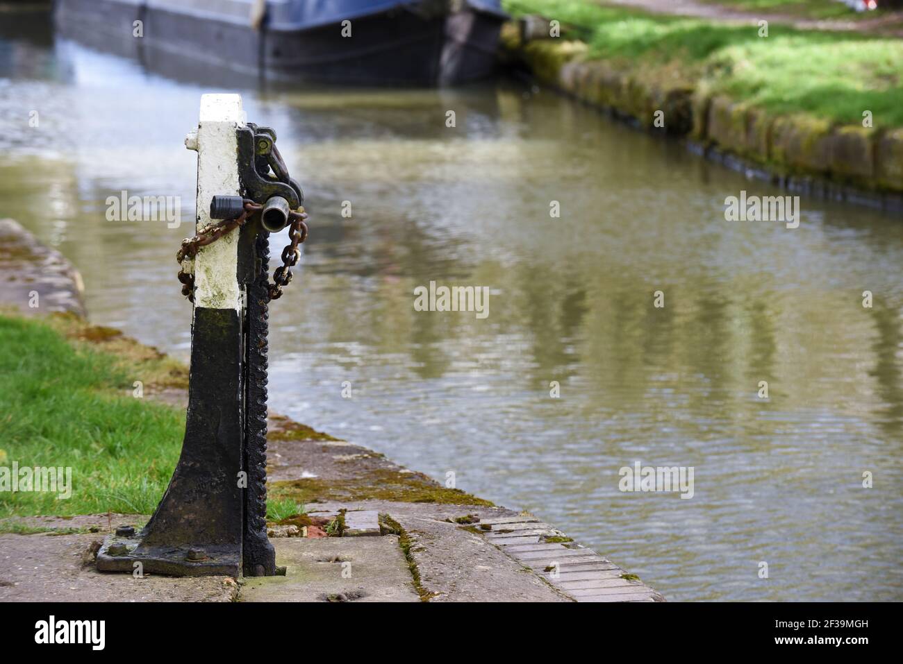 Sluice gate control for flood prevention on canal tow path Stock Photo