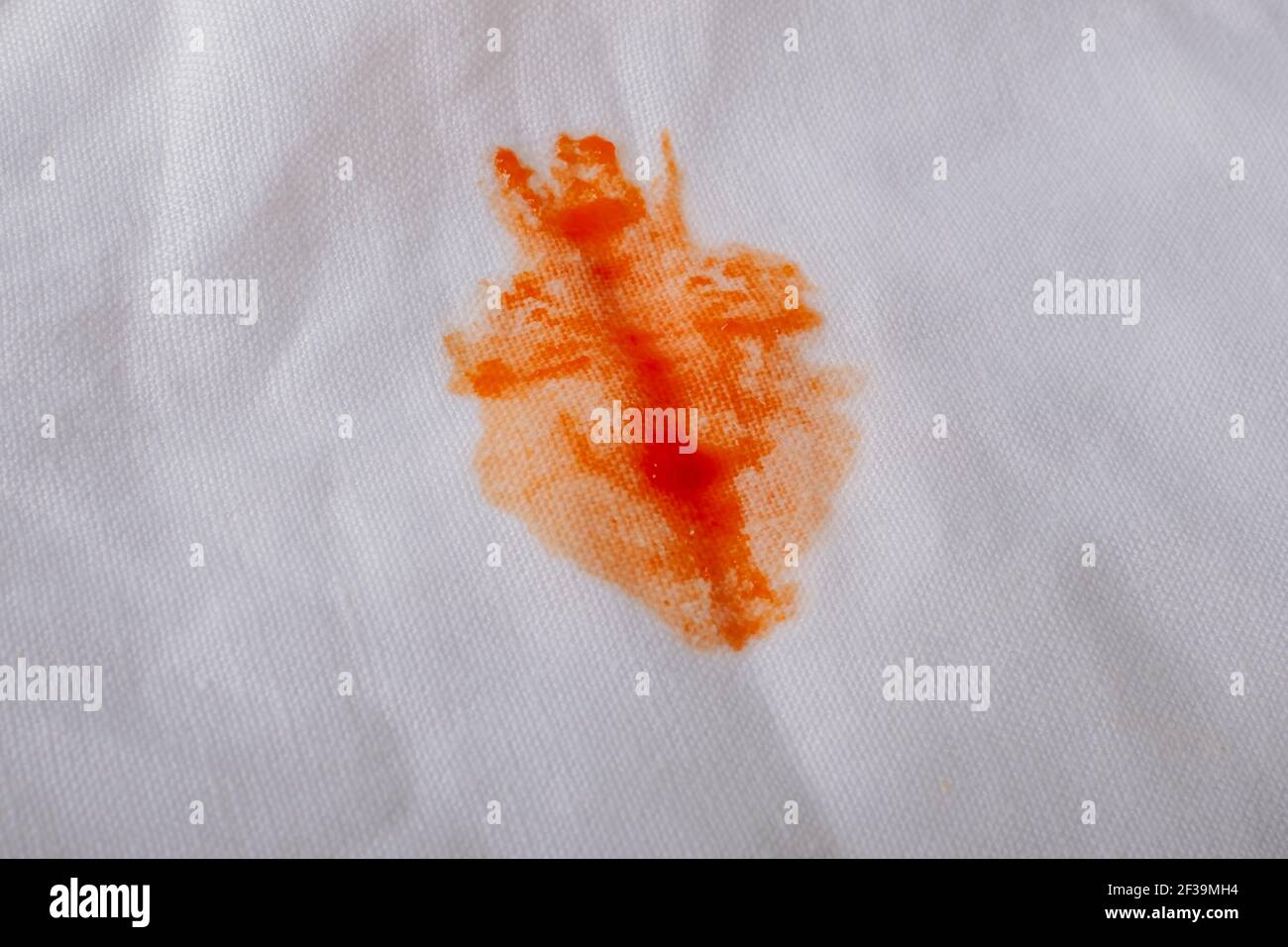 stain of tomato ketchup on clothes and clean concept. . High quality