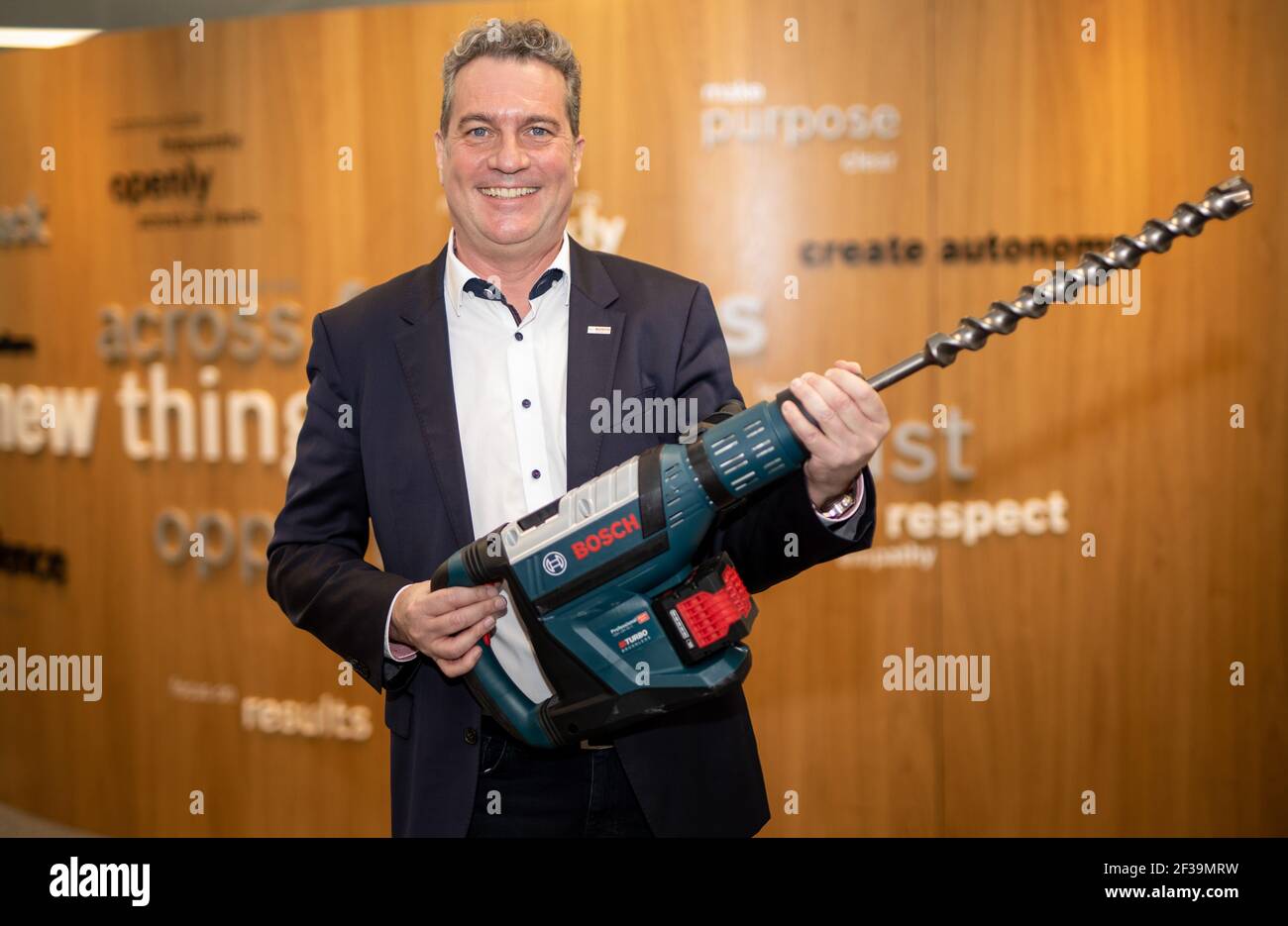 Leinfelden Echterdingen, Germany. 15th Mar, 2021. Henk Becker, chairman of  the board of Bosch Power Tools, holds a GBH 18V-45C Professional hammer  drill in his hands at the company's headquarters. Bosch is