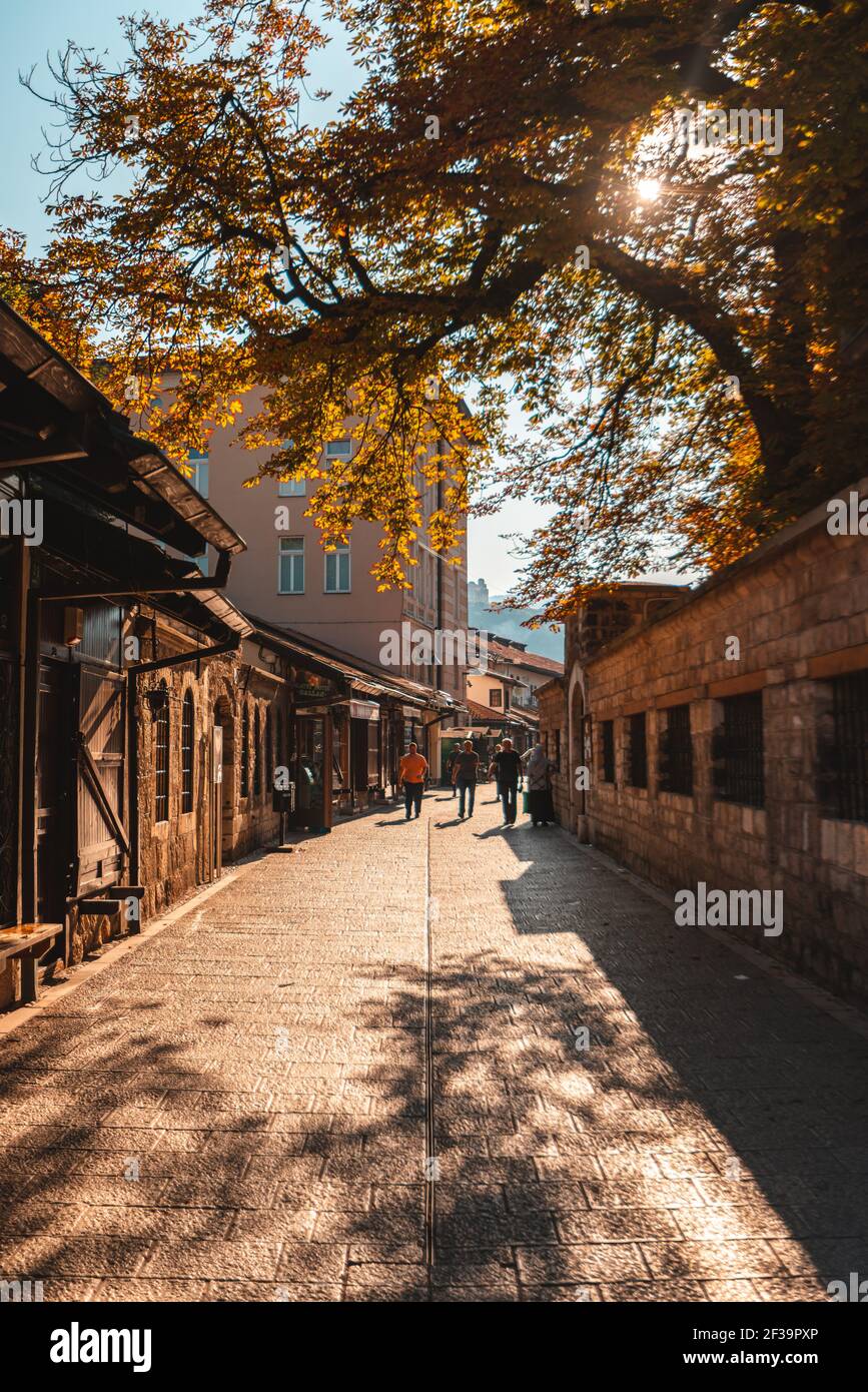 People walking on narrow street in Sarajevo city Stock Photo