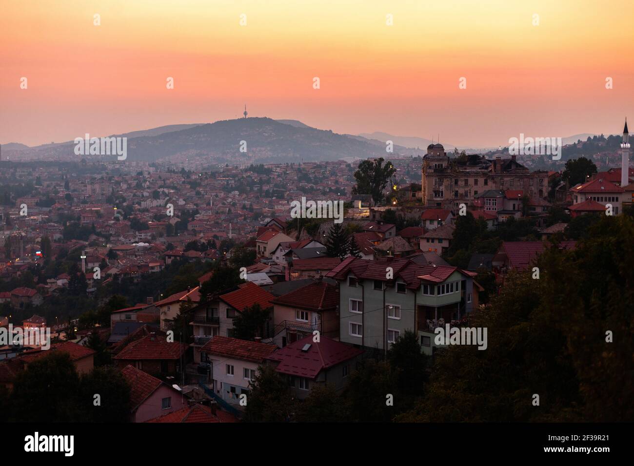 View of Sarajevo cityscape with Hum Tower in background during sunset Stock Photo