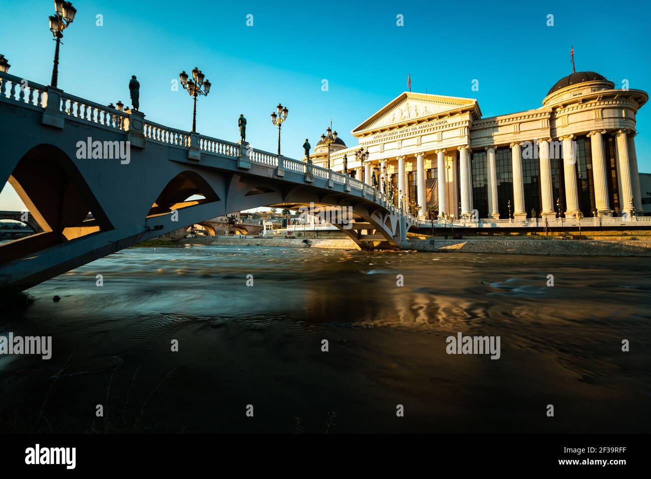 View of The Eye Bridge over Vardar River in front of Archaeological Museum of Macedonia in Skopje city Stock Photo