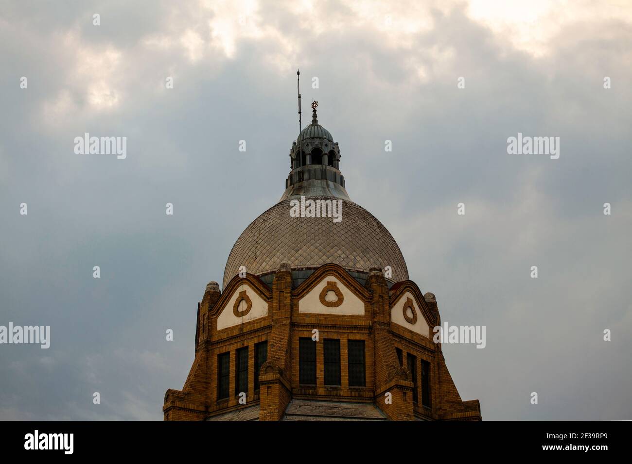 Low angle view of Dome of Synagogue against cloudy sky Stock Photo