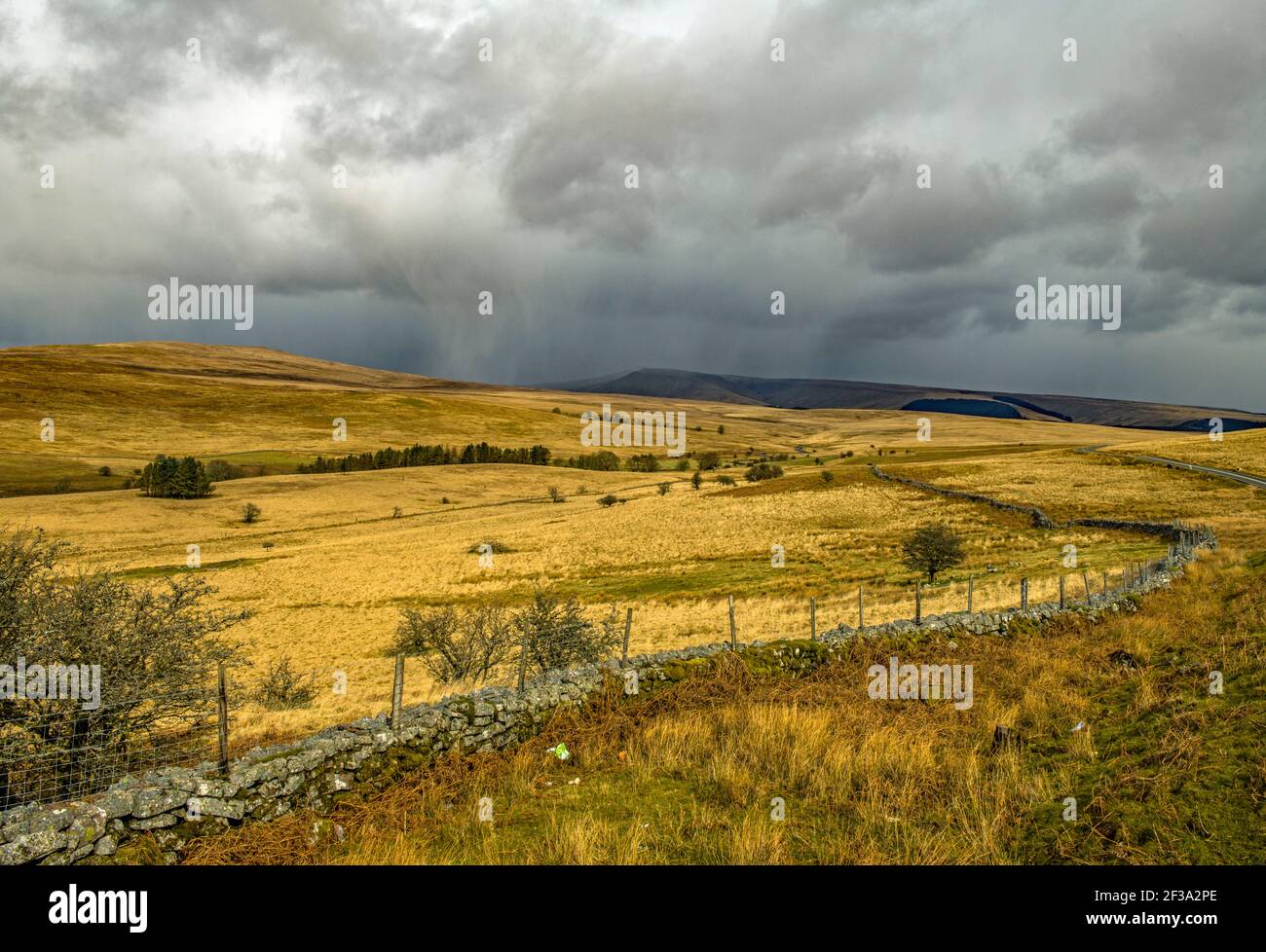 The Brecon Beacons alongside the road A 4059 with a hint of hailstones on their way Stock Photo