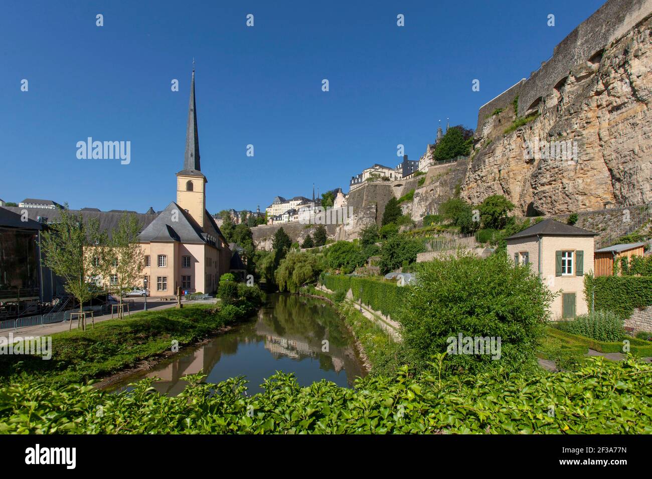 Luxembourg: overview of the city and the former Neumunster Abbey on the banks of the Alzette river in the Old Town, Grund district, abbey converted in Stock Photo