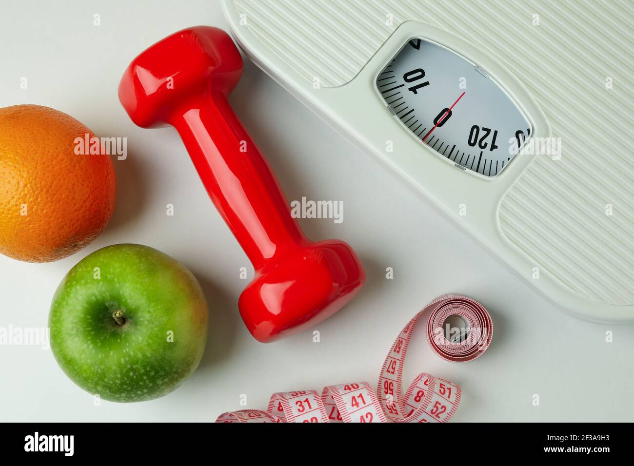 Weight Loss Accessories on White Background, Close Up Stock Photo