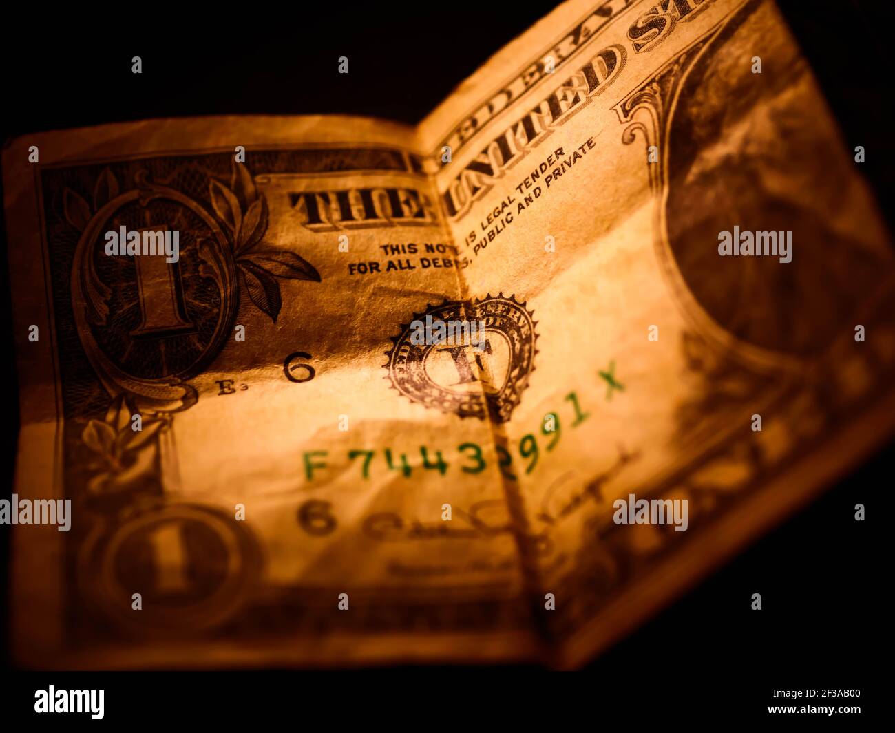 Macro photograph of a one dollar bill. George Washington portrait on