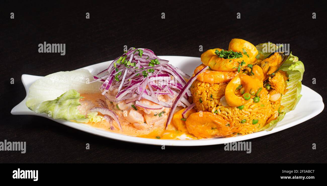 Peruvian traditional food. Ceviche and seafood with rice. Ceviche y Arroz con mariscos Stock Photo