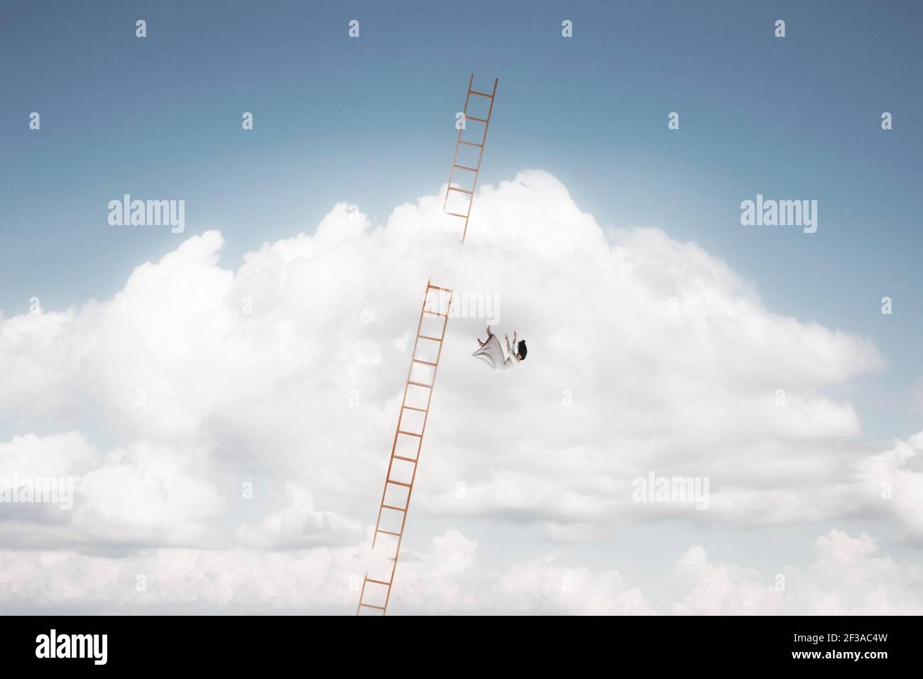 woman falls from a ladder leading to heaven Stock Photo