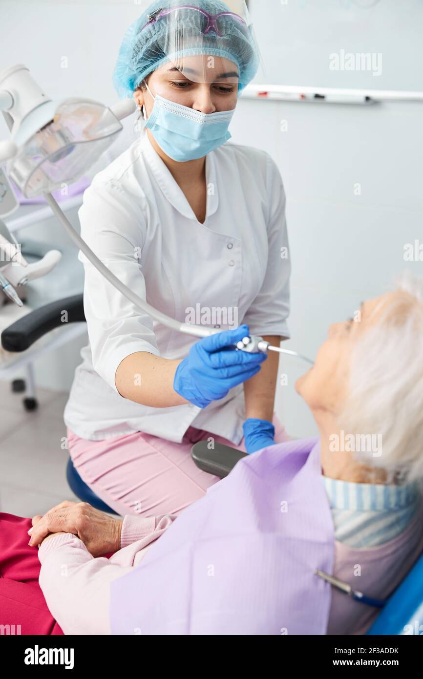 Usage of dental airwater gun on pensioner teeth Stock Photo Alamy