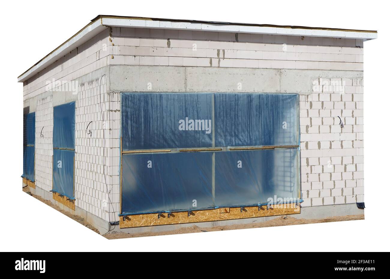 Unfinished village hgome made from white concrete bricks. Isolated on white Stock Photo
