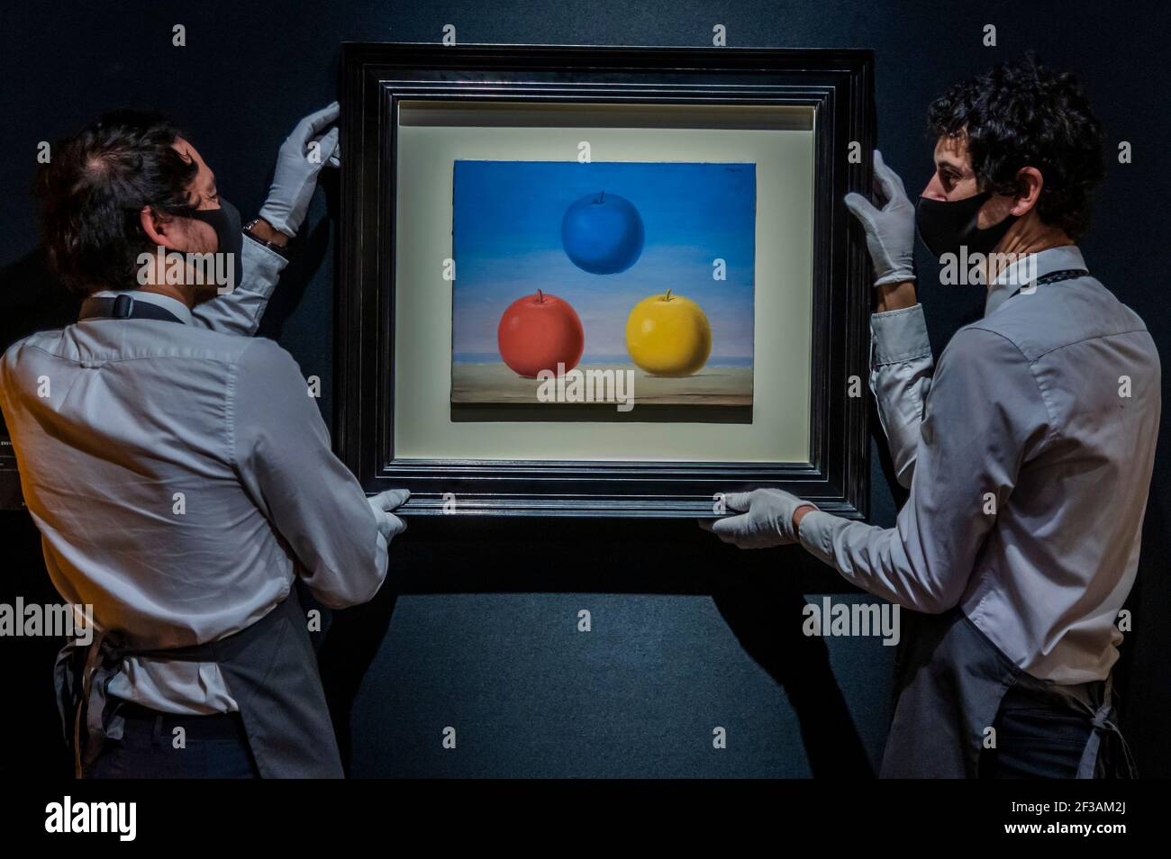 London, UK. 16th Mar, 2021. René Magritte, Les jeunes amours, Painted in 1963 Estimate: £2,000,000-3,000,000 - Behind closed doors: preparations take place at christie's ahead of the livestreamed 20th century art evening sale and the art of the surreal sale on 23 march Credit: Guy Bell/Alamy Live News Stock Photo