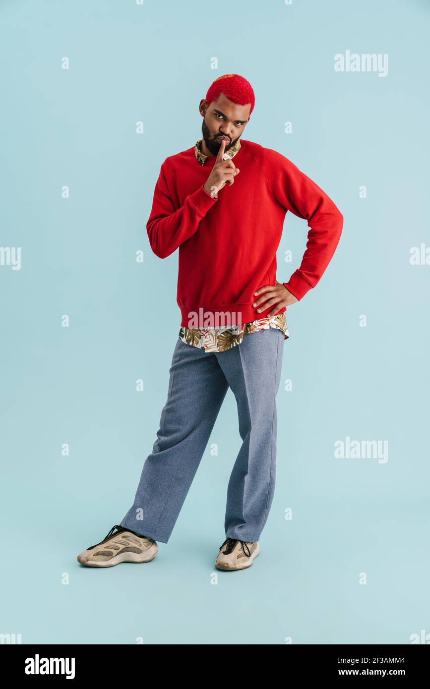 Am Using Guy Amusing african american guy showing silence gesture on camera isolated ...