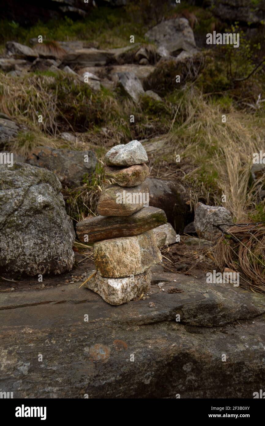 Stone's stacked on top of each other indicating the direction to follow on the trail. Direction points. Stock Photo