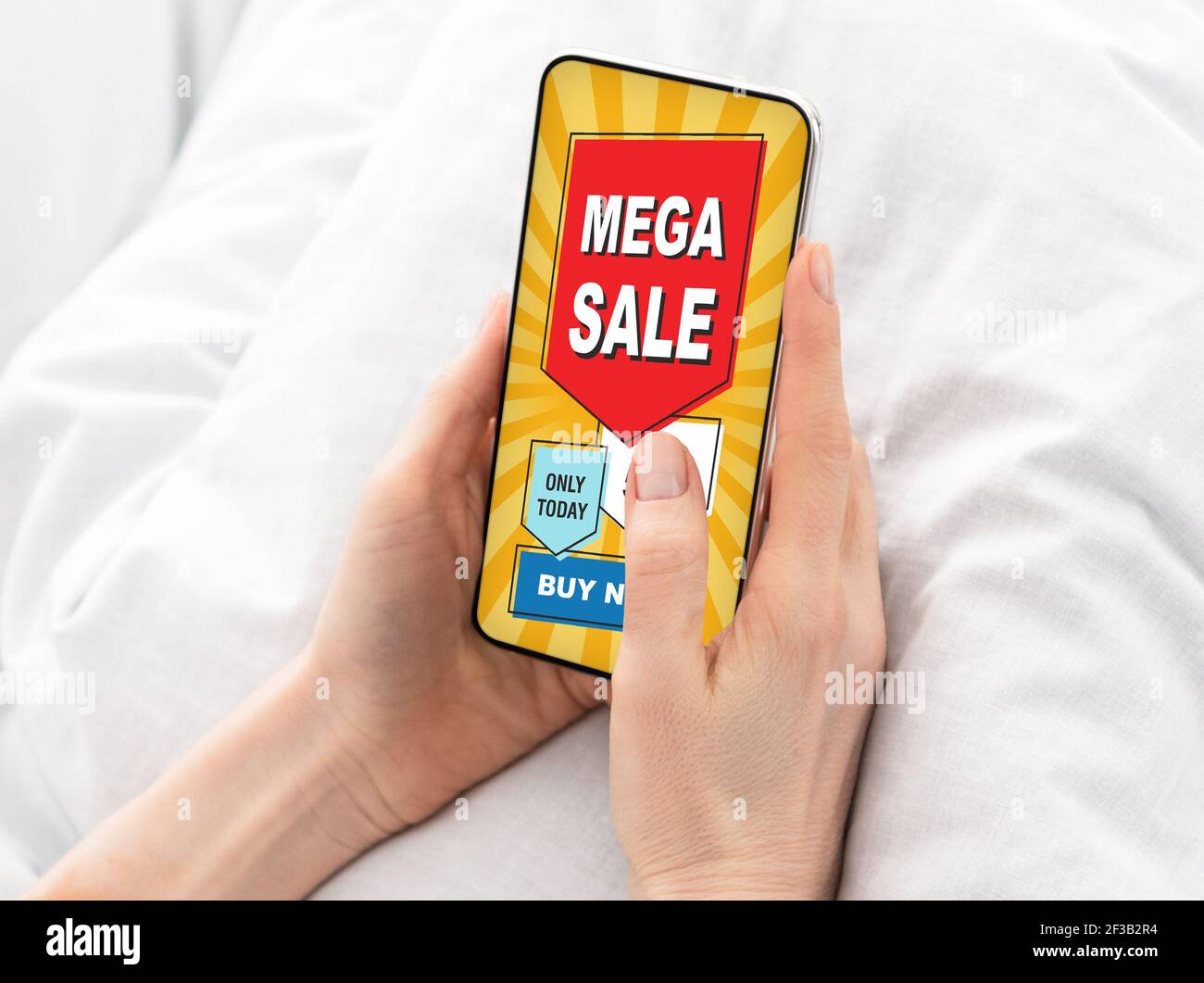 Closeup of feman hands holding smartphone with shopping mobile application Stock Photo