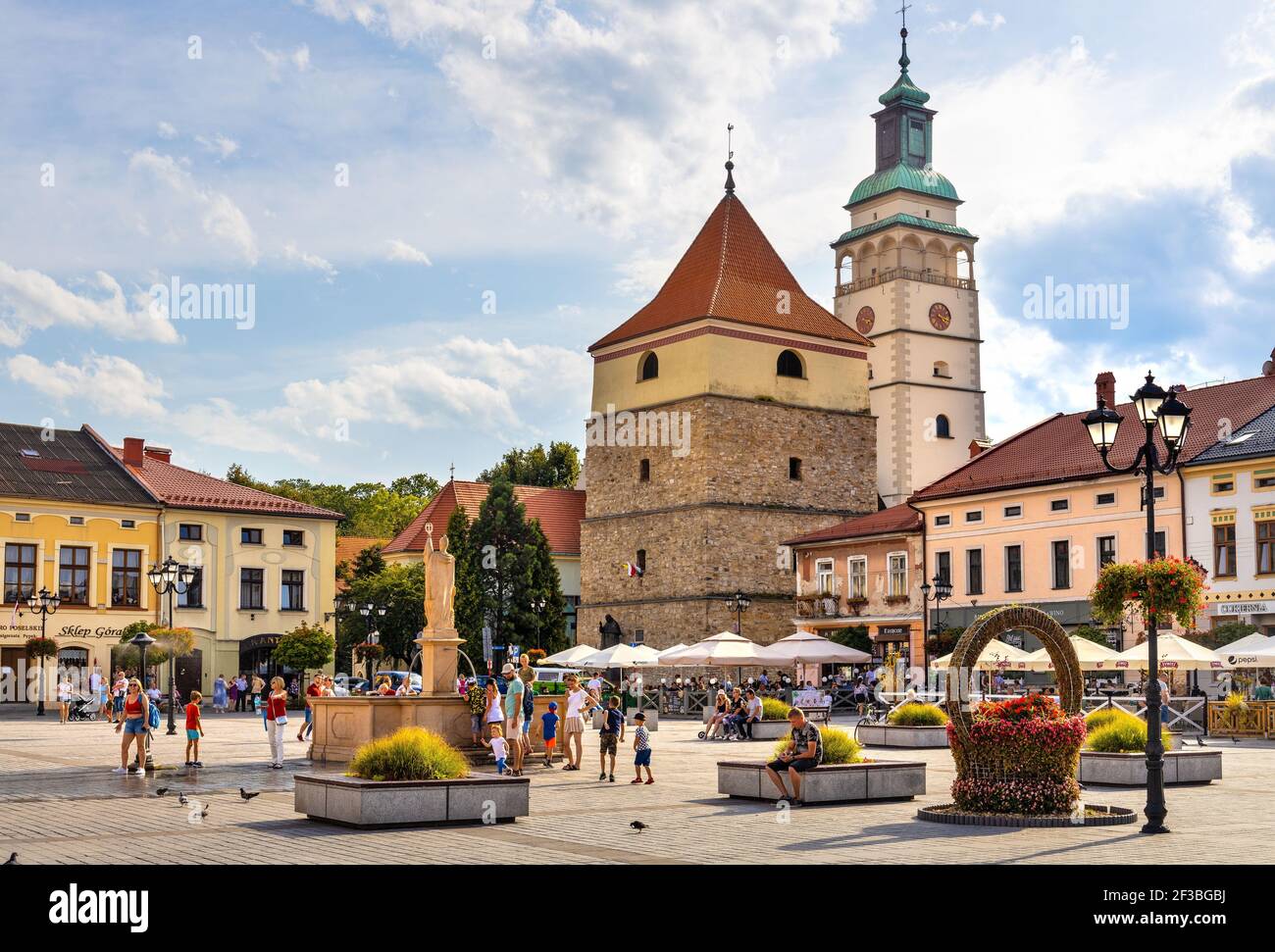 Zywiec, Poland - August 30, 2020: Panoramic view of market square with historic stone bell tower and Cathedral of Nativity of Blessed Virgin Mary in S Stock Photo