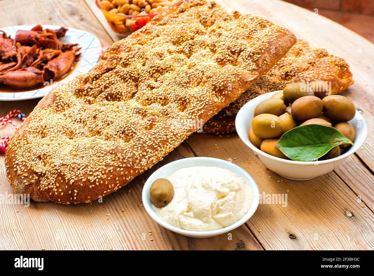 Traditional greek bread (lagana) , olives, seafood , taramas Stock ...