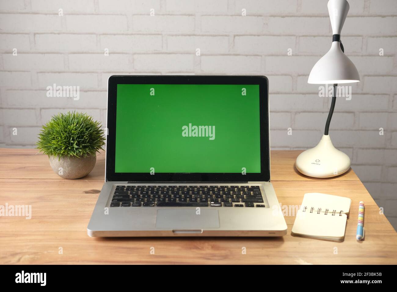 laptop with blank screen on office desk Stock Photo - Alamy