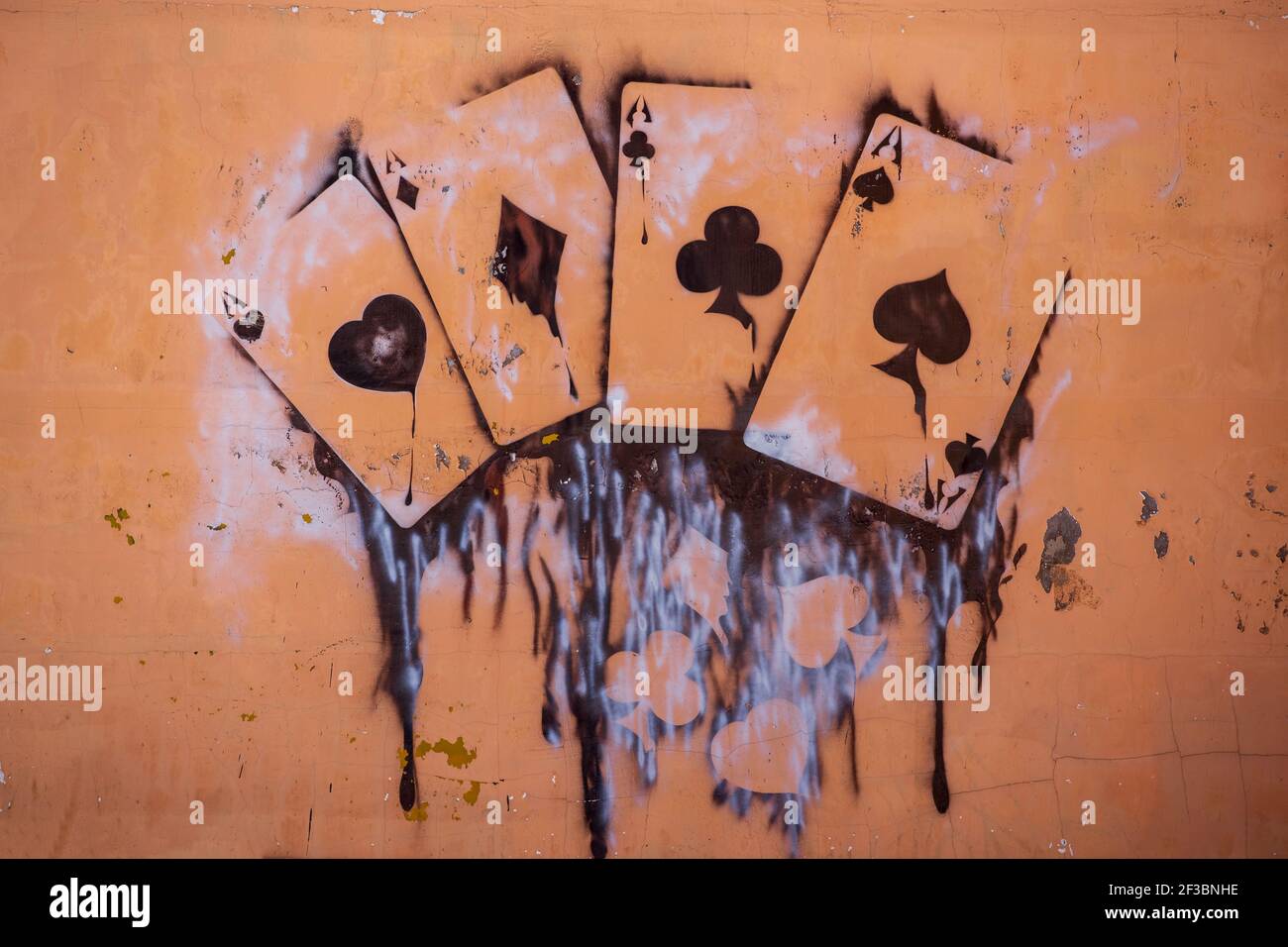 Russia Vyborg. 02.02.2021. drawing playing cards on the wall with paint cans Stock Photo
