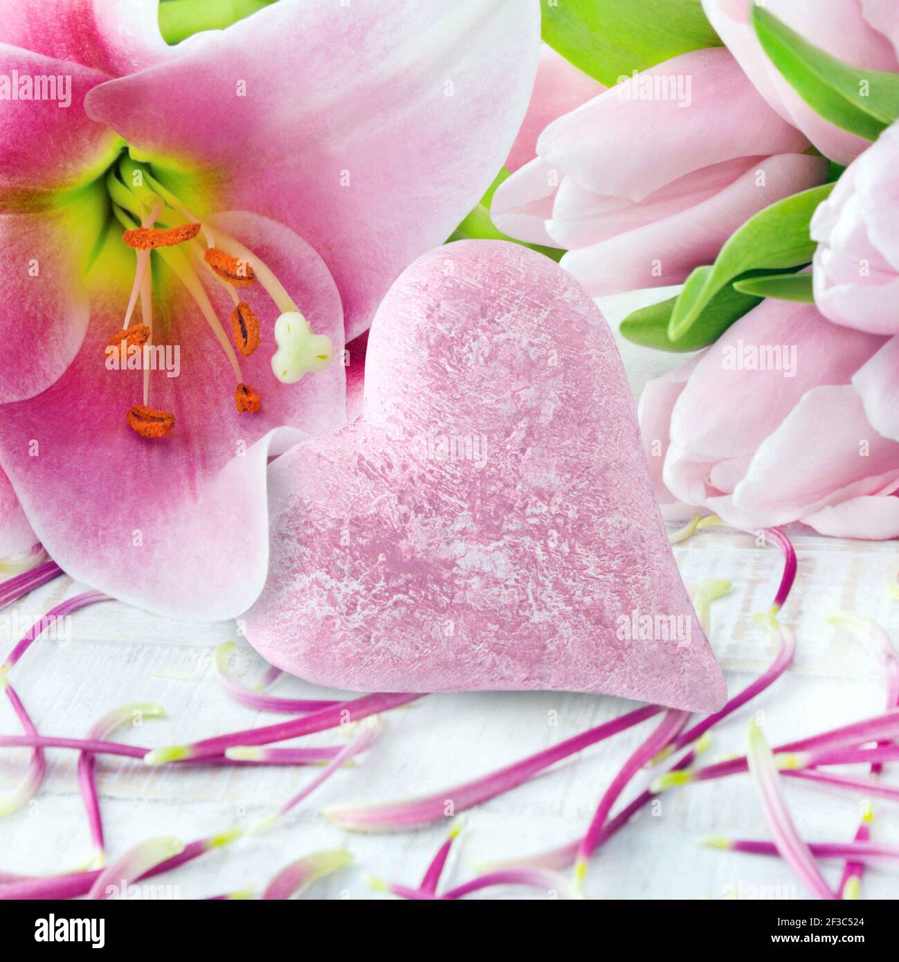 Lily and pink tulips with heart Stock Photo