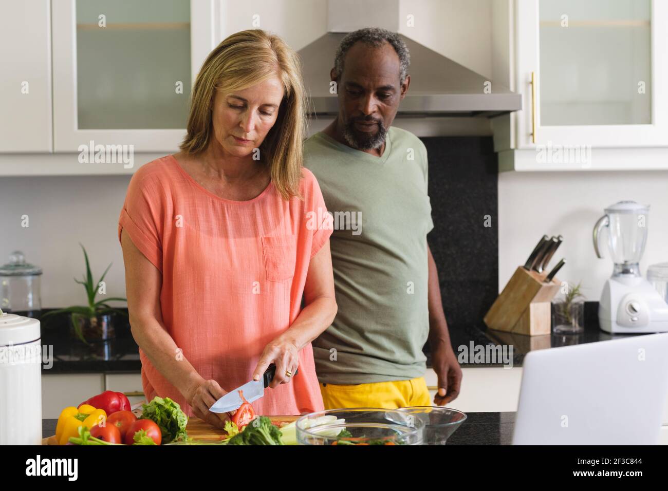 Couple standing in kitchen hi-res stock photography and images - Alamy