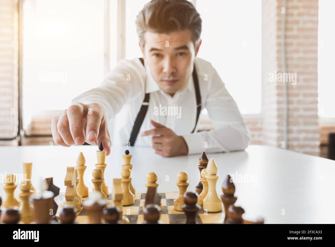 planning strategy with chess figures on an old wooden table