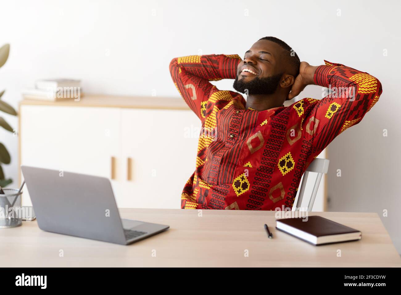 Man desk leaning back hands hi-res stock photography and images - Alamy