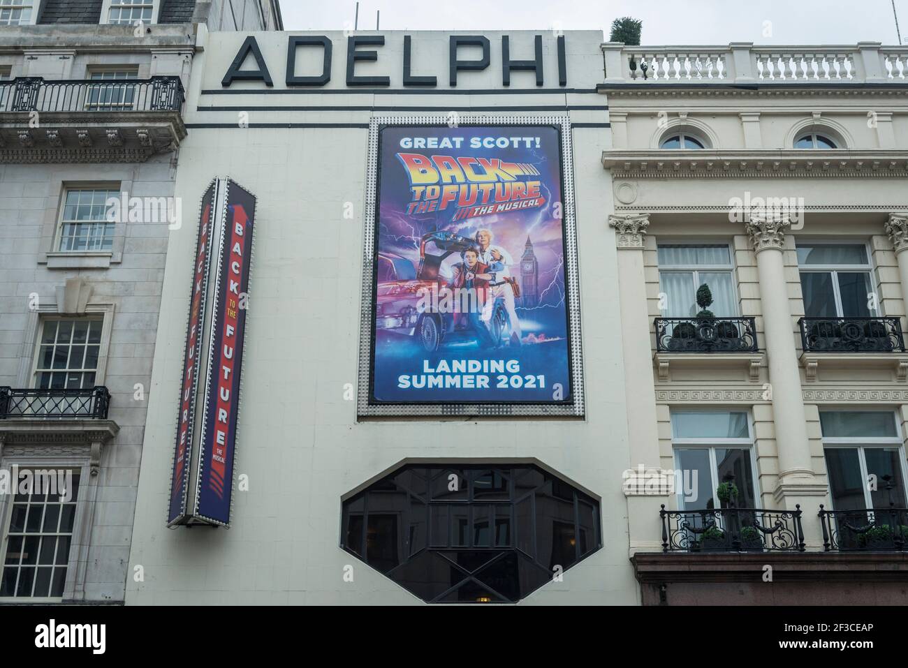London, UK. 16 March 2021. Exterior signage promoting “Back To The Future –  the musical” at the Adelphi Theatre on The Strand, which is due to arrive  Summer 2021. The West End