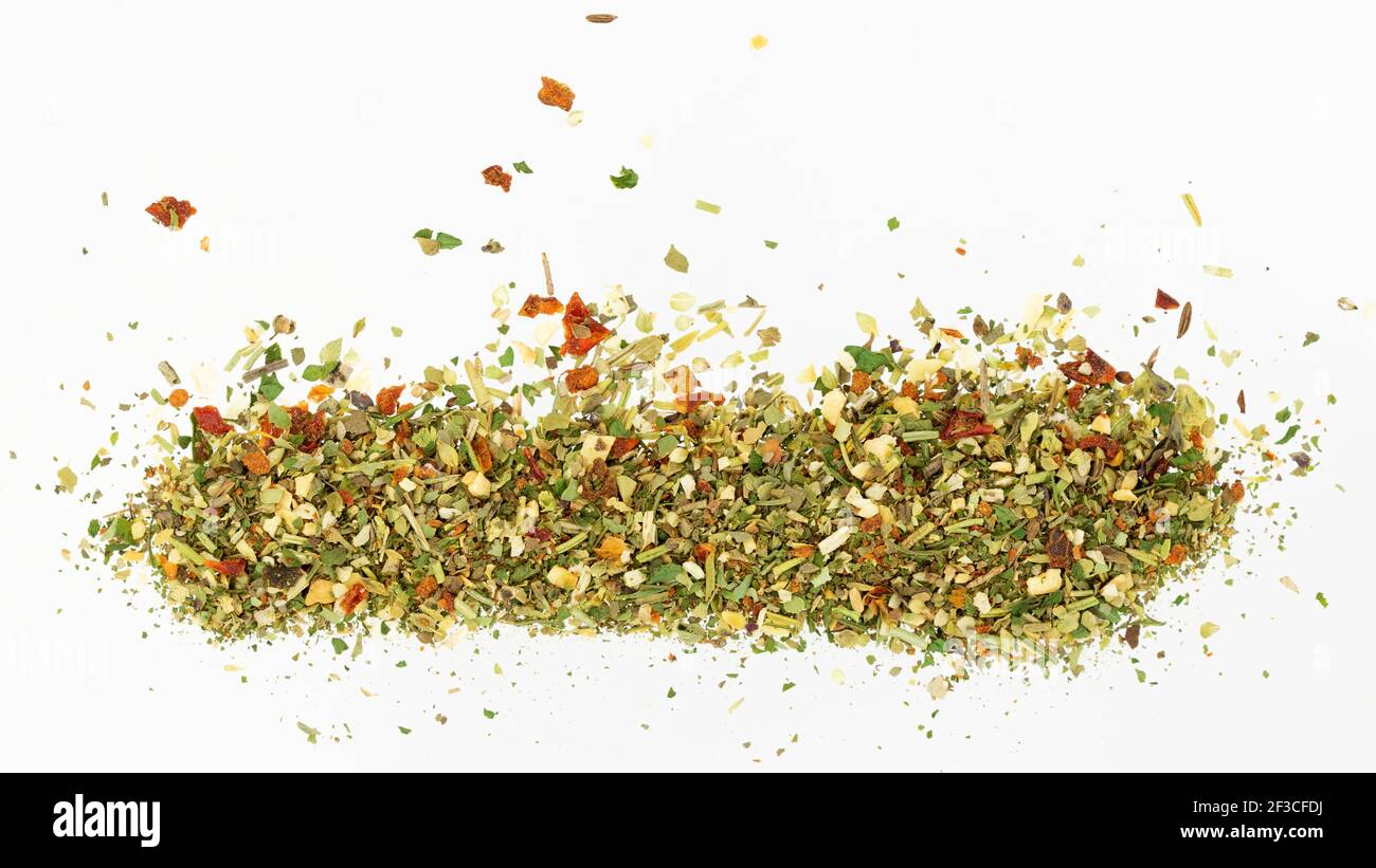 Pile of dried spices isolated on white background. Spice for pizza. Top view, close-up Stock Photo