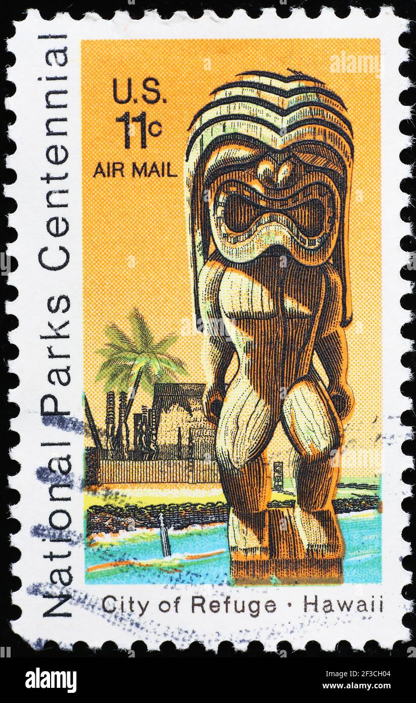 Ancient hawaiian protector statue on vintage american stamp Stock Photo