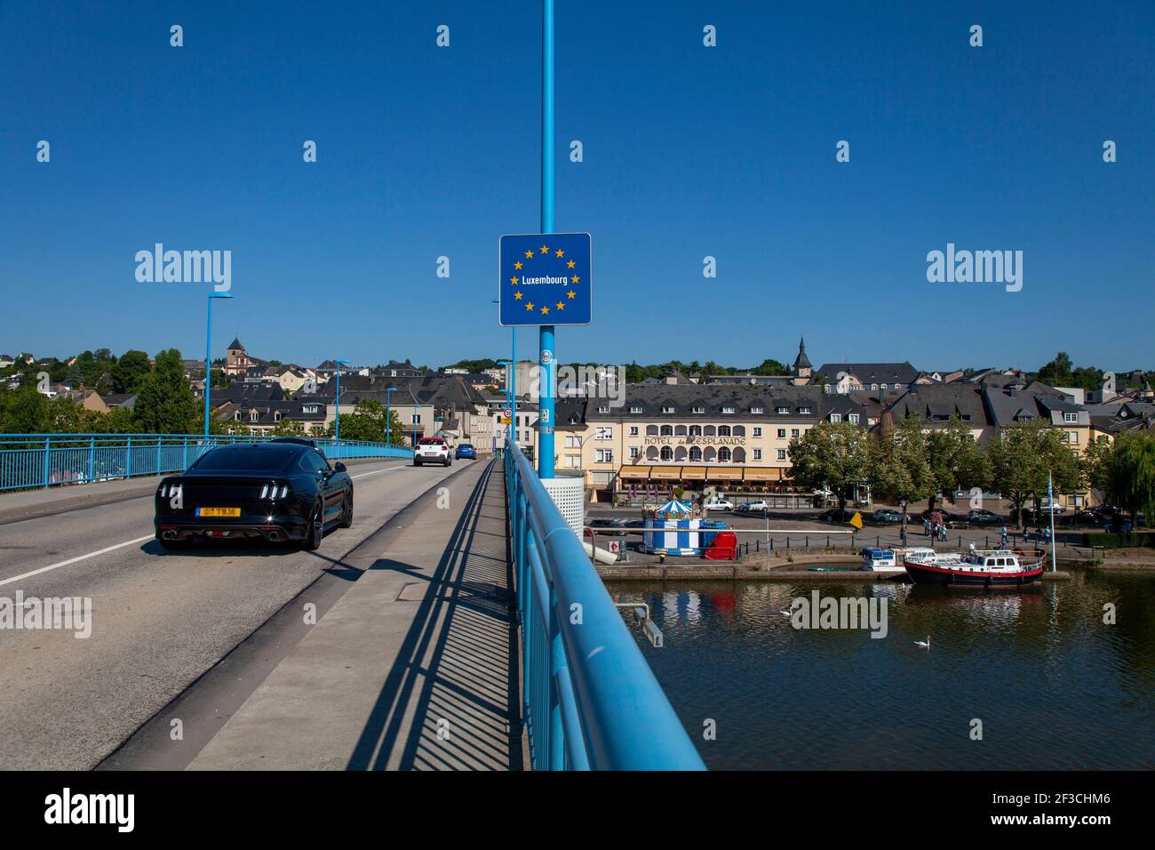 Luxembourg: overview of the town of Remich from the bridge across the River Moselle, border between Luxembourg and Germany. Car and Luxembourg road si Stock Photo