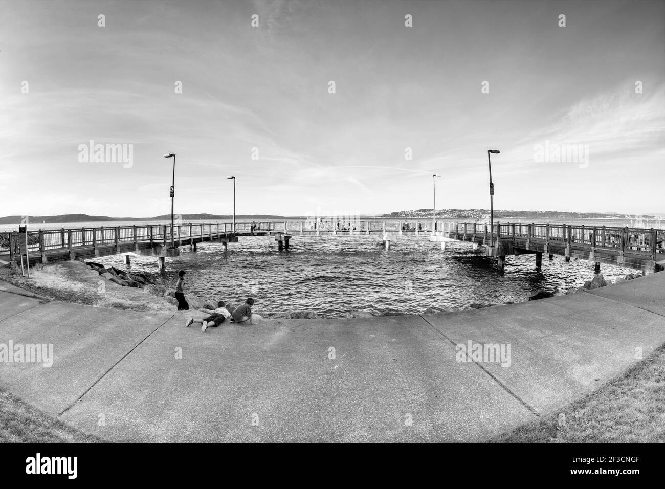 The pier at Marine (Jack Tanner) Park in Tacoma, WA with fishermen on a Friday night. Stock Photo
