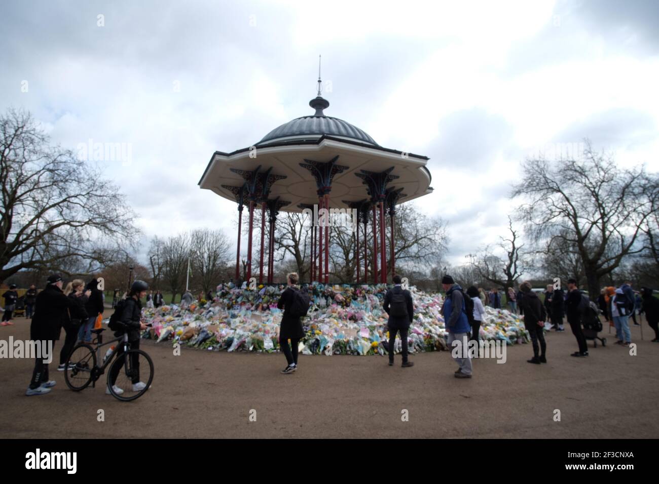 London, UK. 16th March, 2021. Mourners place flowers on the bandstand on Clapham common following the murder of Sarah Everard Credit: david mccairley/Alamy Live News Stock Photo
