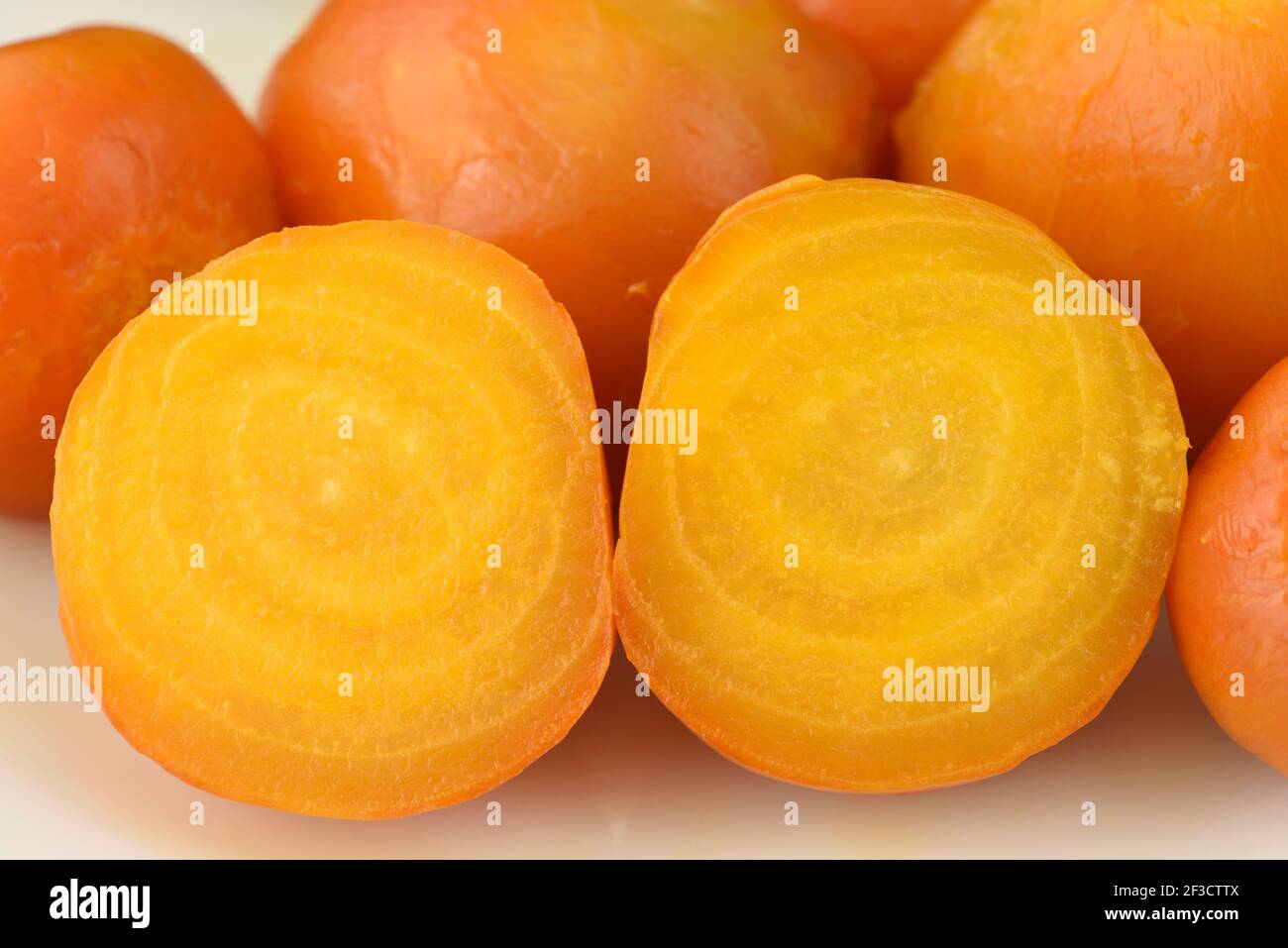 Beta vulgaris  'Golden Eye'  Beetroot  Cooked roots one cut in half  August Stock Photo