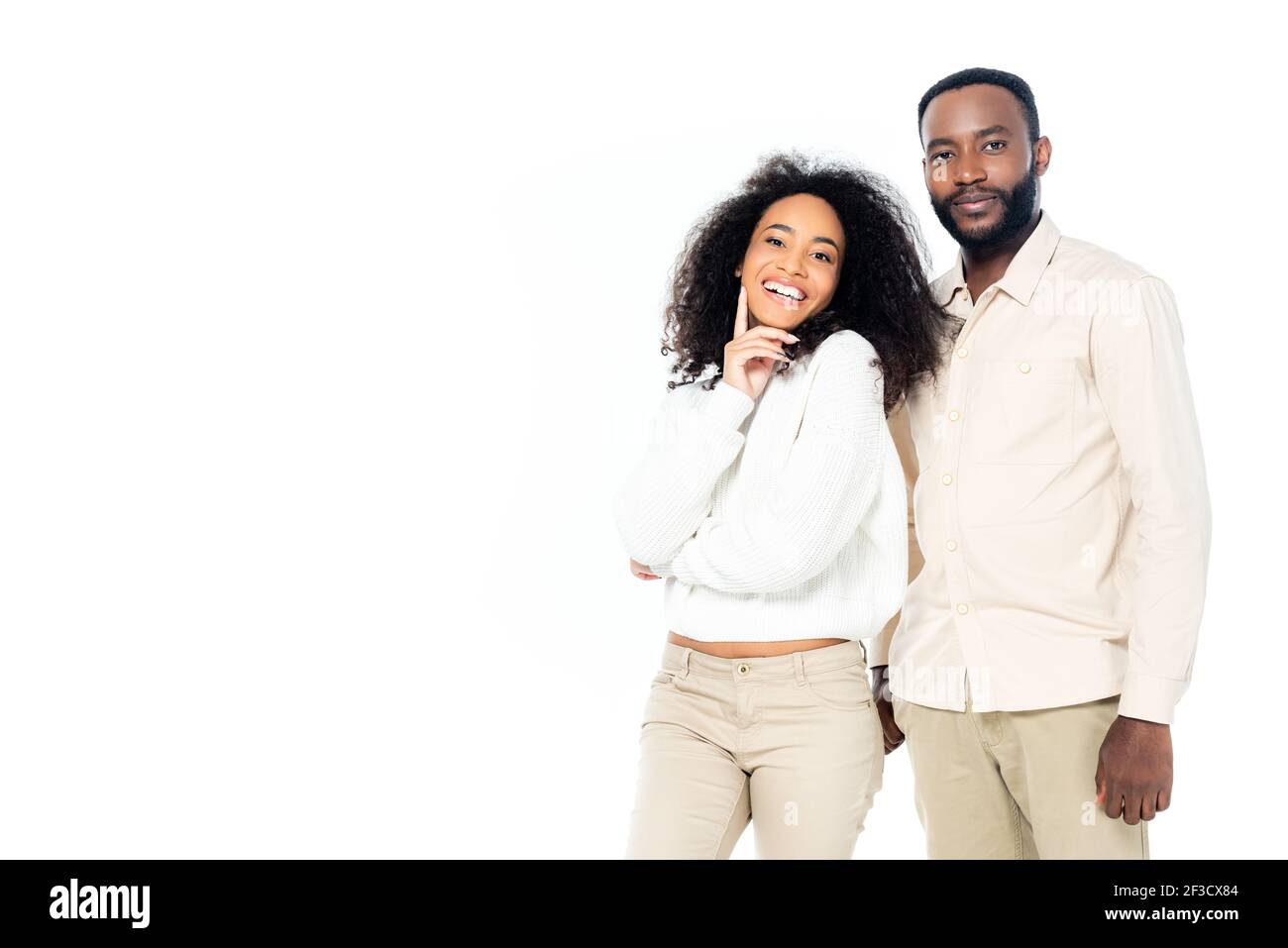 cheerful african american woman standing near smiling husband isolated ...