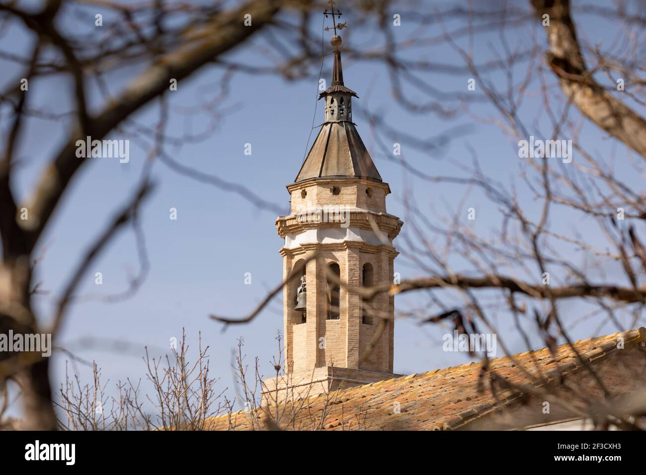 Photograph of the bell tower of the church of Santa Maria, of late Gothic architectural style, in the small town of Bulbuente, in the Campo de Borja r Stock Photo