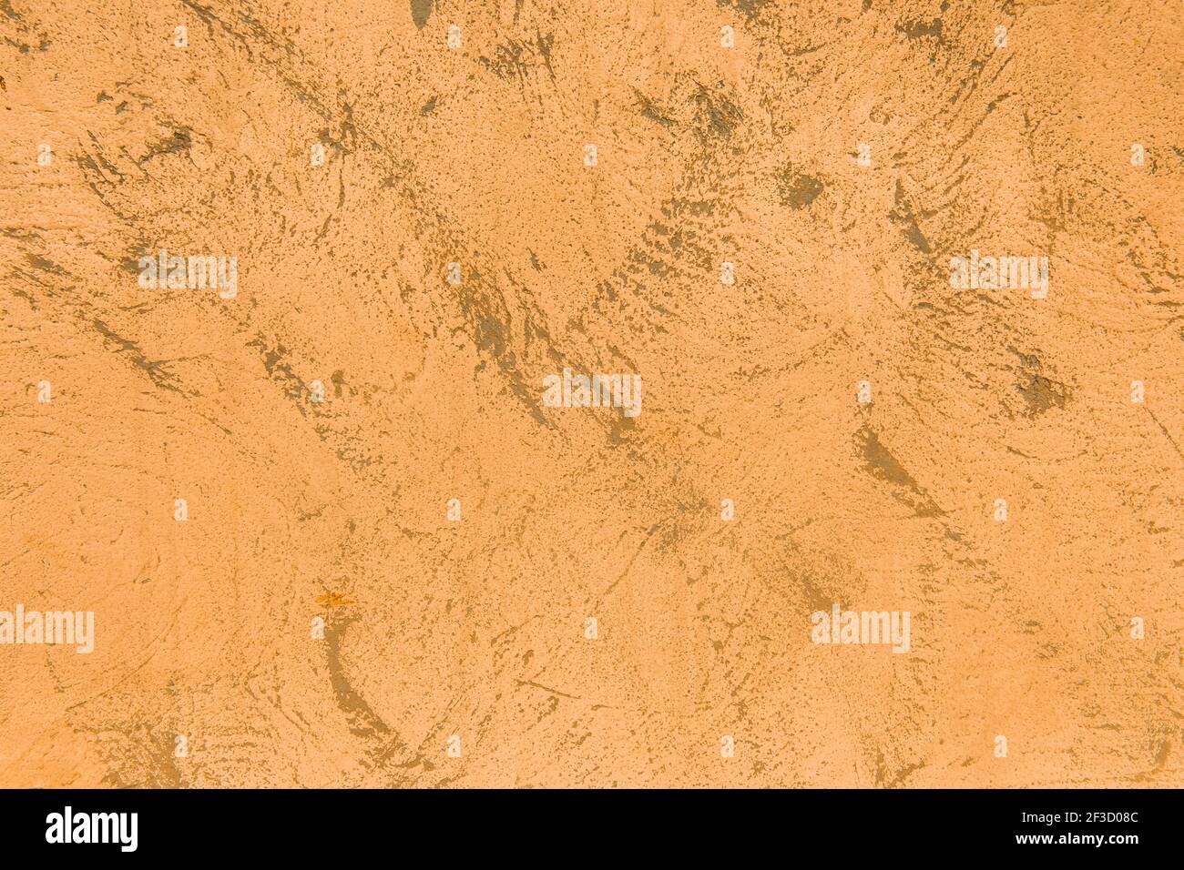 Light orange or brown wall texture with dark abstract background pattern. Stock Photo