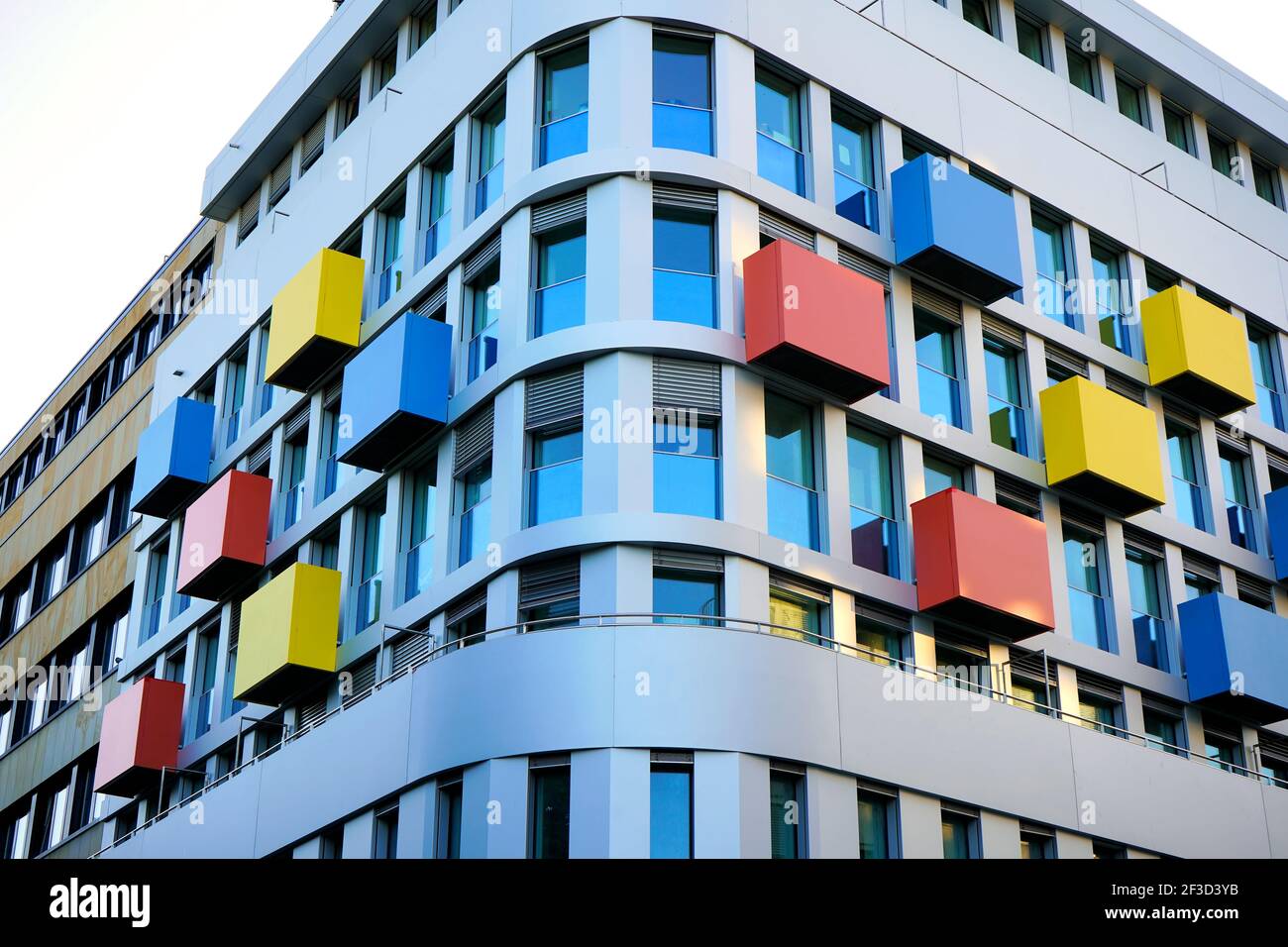 Modern building with colourful blue, red and yellow elements in Düsseldorf near Main Station. Stock Photo