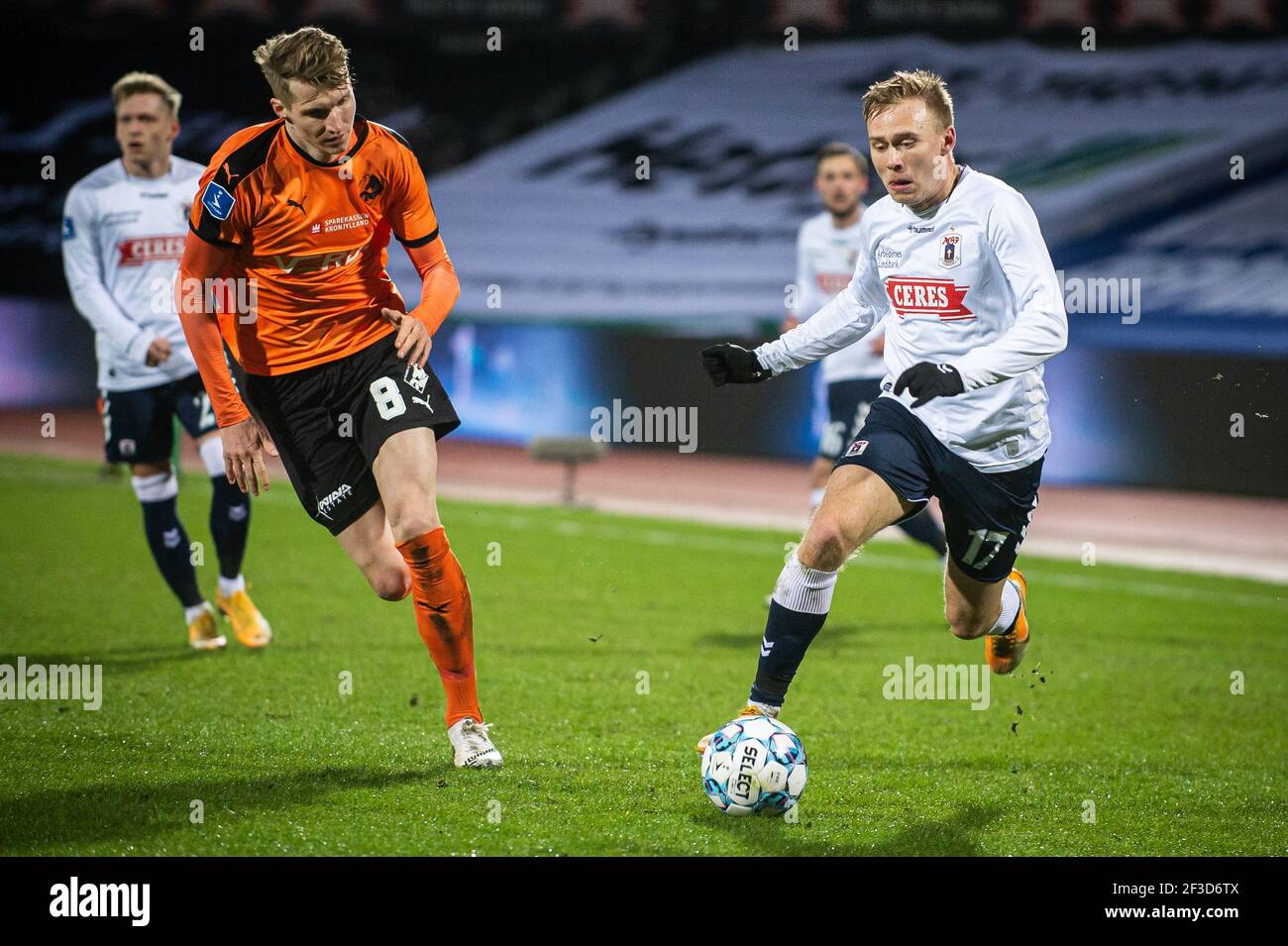 Aarhus, Denmark. 15th Mar, 2021. Jon Thorsteinsson (17) of AGF and Simon  Piesinger (8) of Randers FC seen during the 3F Superliga match between  Aarhus GF and Randers FC at Ceres Park