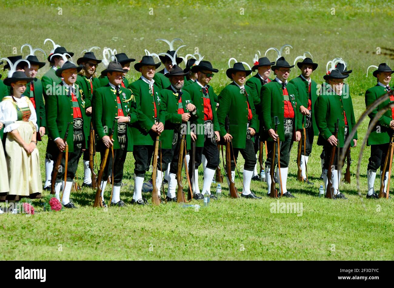 Feichten, Tyrol, Austria - June 22, 2014: Unidentified Tyrolean gun men in traditional suit and weapons by field mass in Kaunertal valley Stock Photo