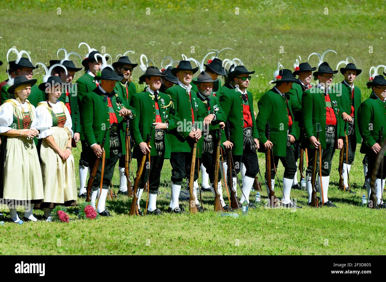 Feichten, Tyrol, Austria - June 22, 2014: Unidentified Tyrolean gun men in traditional outfit and weapons by field mass in Kaunertal valley Stock Photo