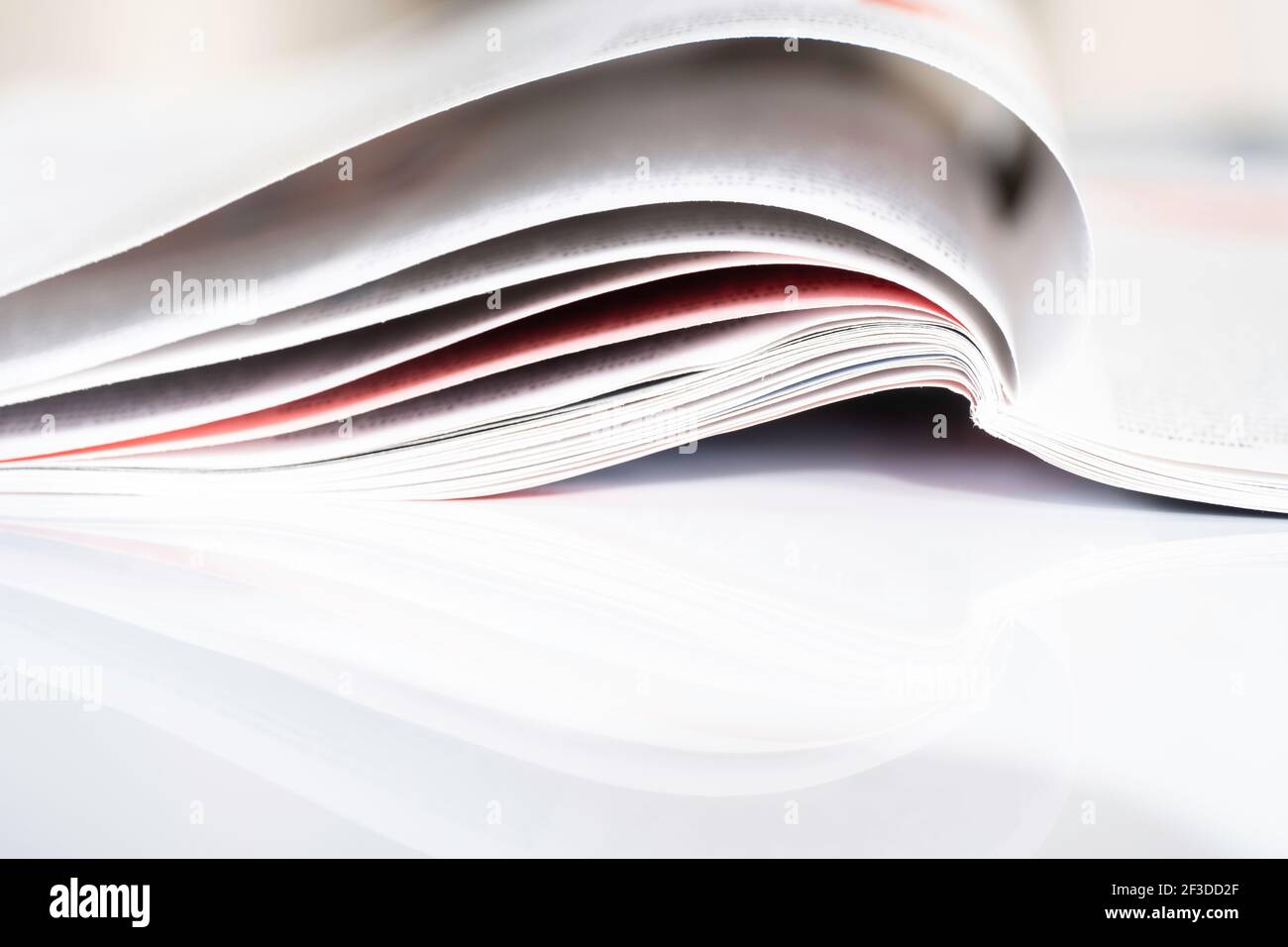 Open magazine on table hi-res stock photography and images - Alamy