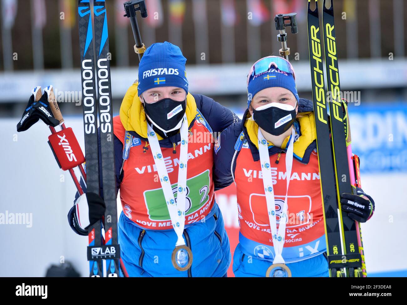 Linn Persson, right, and Sebastian Samuelsson from Sweden celebrate after  winning the single mixed relay at the Biathlon World Cup in Nove Mesto na  Morave, Czech Republic, March 14, 2021. (CTK Photo/Lubos