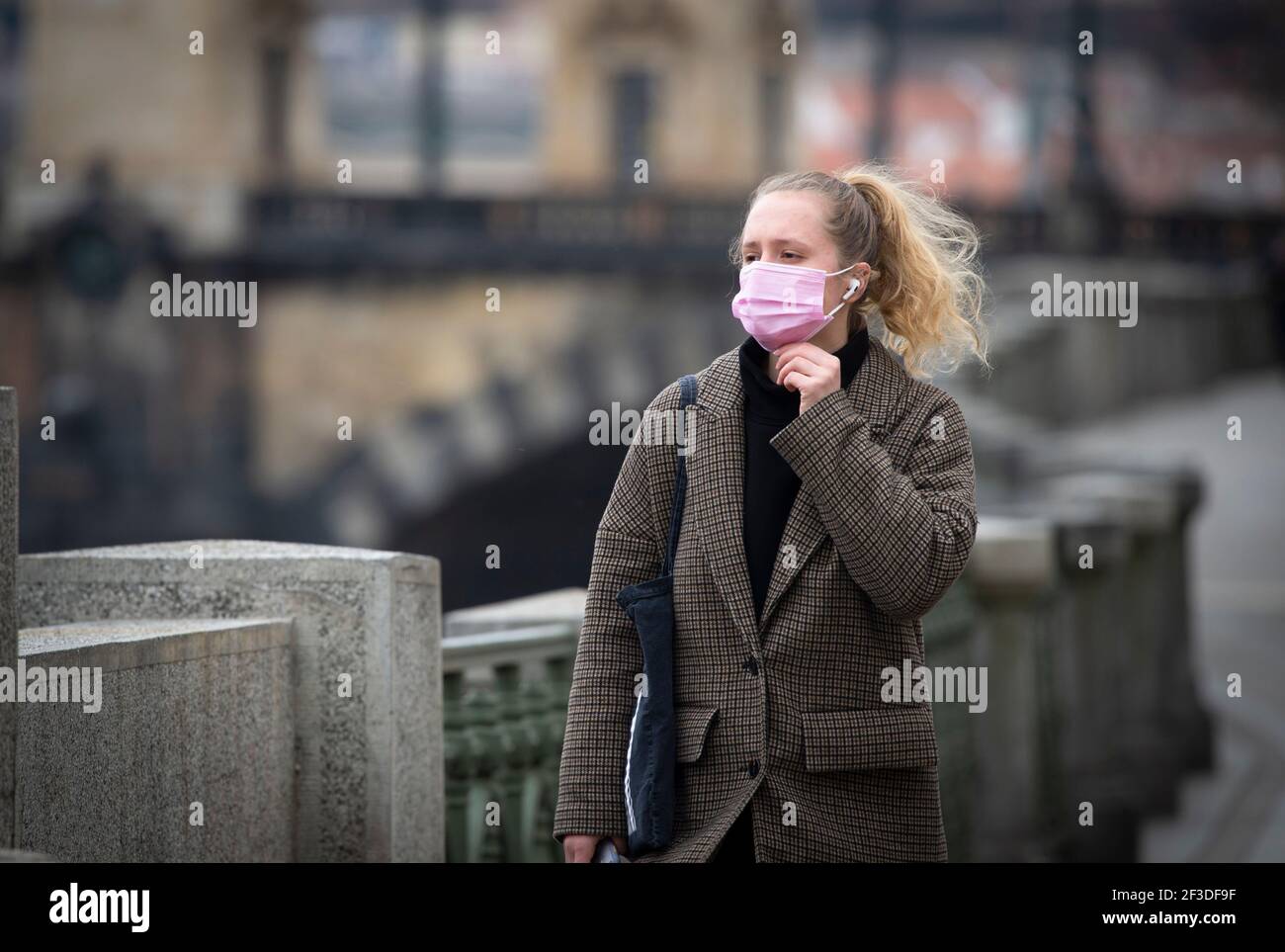 Prague, Czech Republic. 16th Mar, 2021. A woman wears a face mask against the spread of the COVID-19 in Prague, Czech Republic, March 16, 2021. Since the beginning of last March when the first COVID cases occurred in the Czech Republic, over 1.41 million people have been infected, out of whom 1.21 million have recovered. There are over 78,000 currently infected with COVID-19. Credit: Katerina Sulova/CTK Photo/Alamy Live News Stock Photo