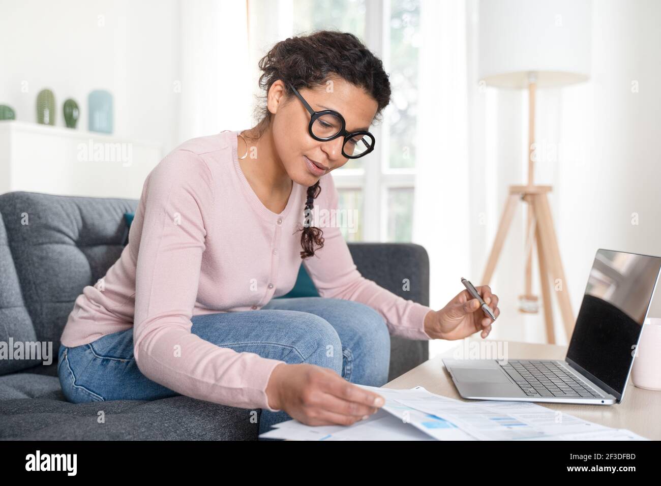 Black woman home office and distance remote working Stock Photo