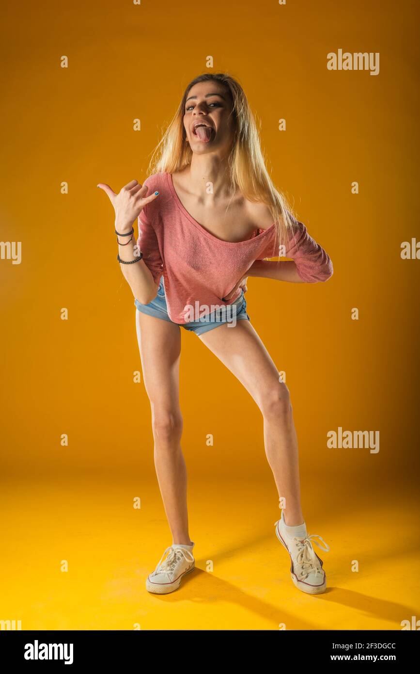 pleasure-models Sporty lovely girl in tank-top and denim shorts dancing with pleasure and  smiling. Indoor portrait of stunning female model with vintage hairstyle  wav Stock Photo - Alamy