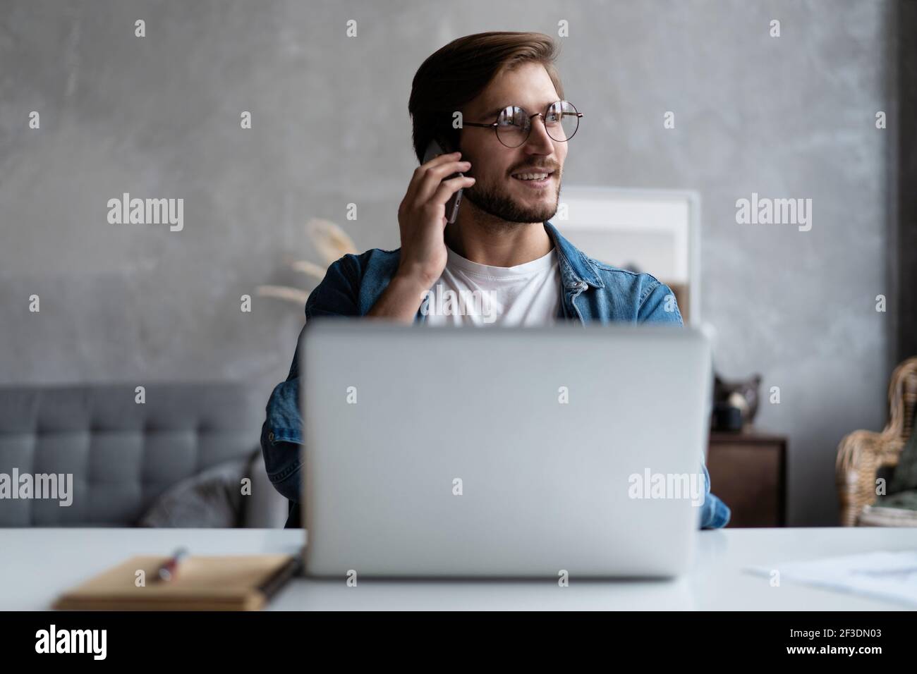 Marketing sales manager consulting client making offer selling talking on  phone near laptop in home office Stock Photo - Alamy