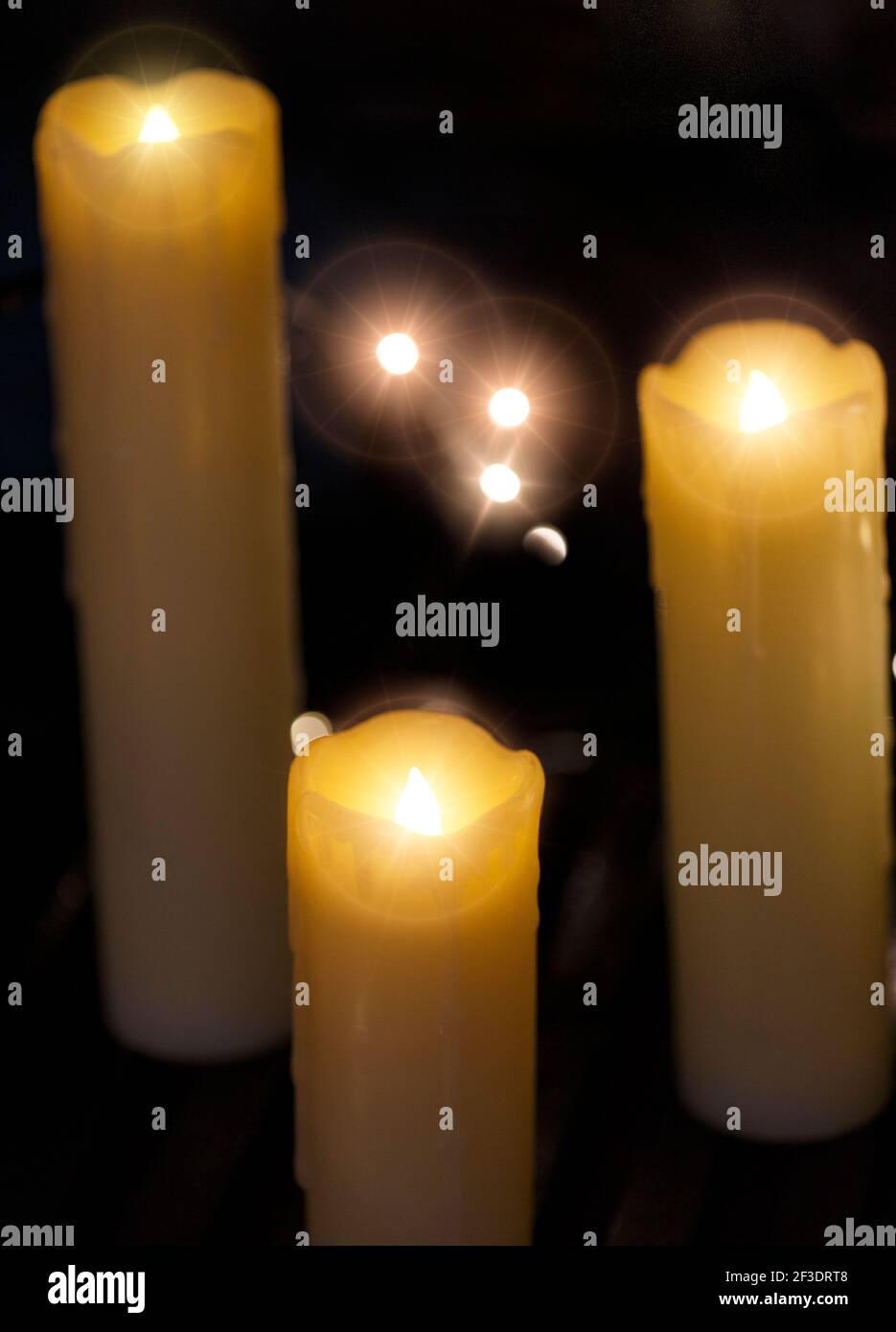 Traditional Christmas and event celebration decorations in the form of artificial illuminated candles. Stock Photo