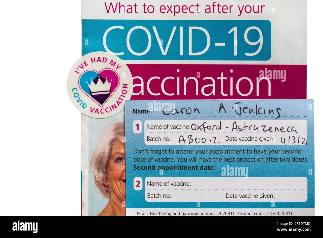 Covid-19 Vaccination leaflet with I've had my Covid vaccination sticker & vaccination record card issued by NHS for Oxford AstraZeneca vaccine Stock Photo