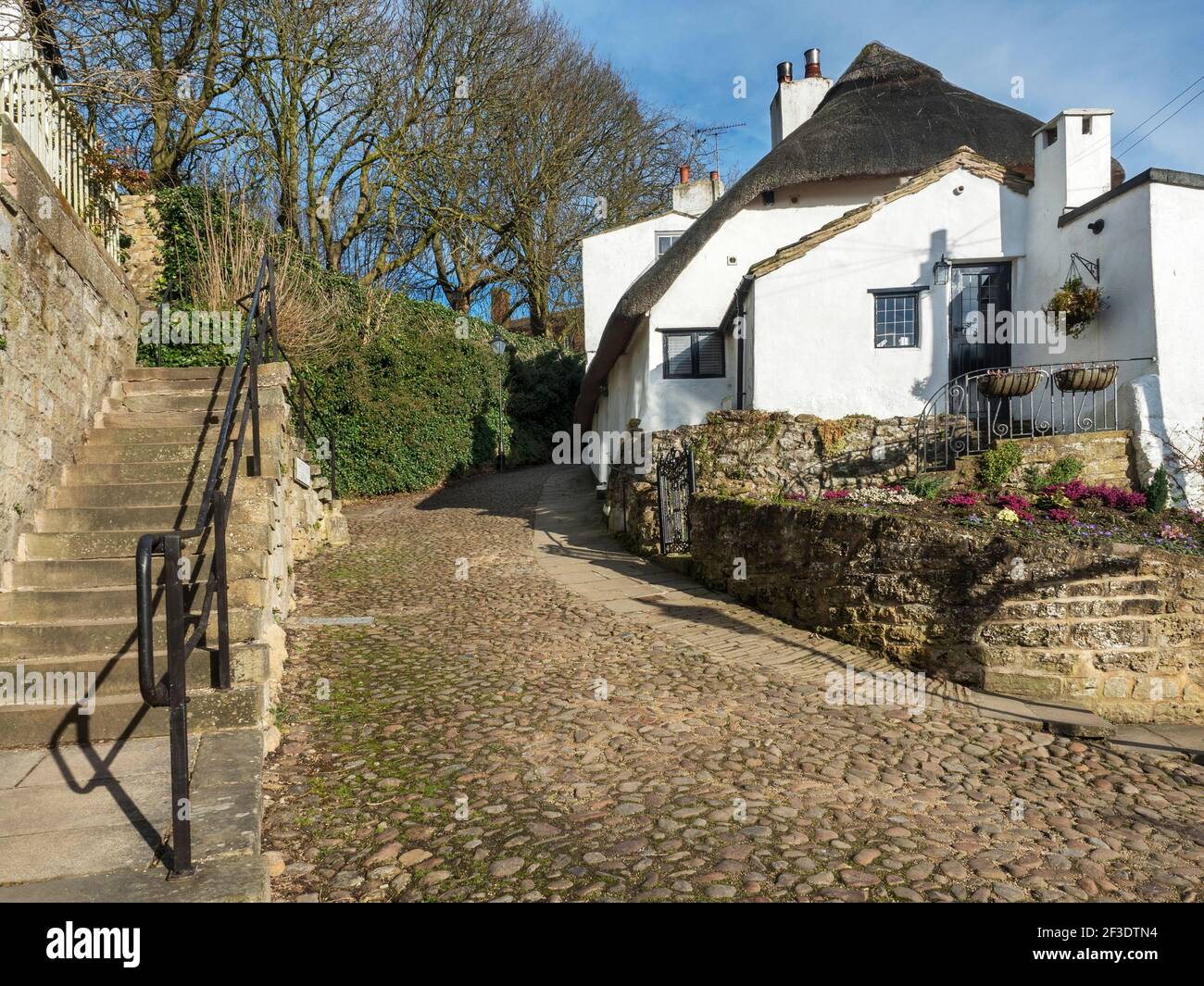 Cobbled lane Water Bag Bank and Manor Cottage in Knaresborough North Yorkshire England Stock Photo